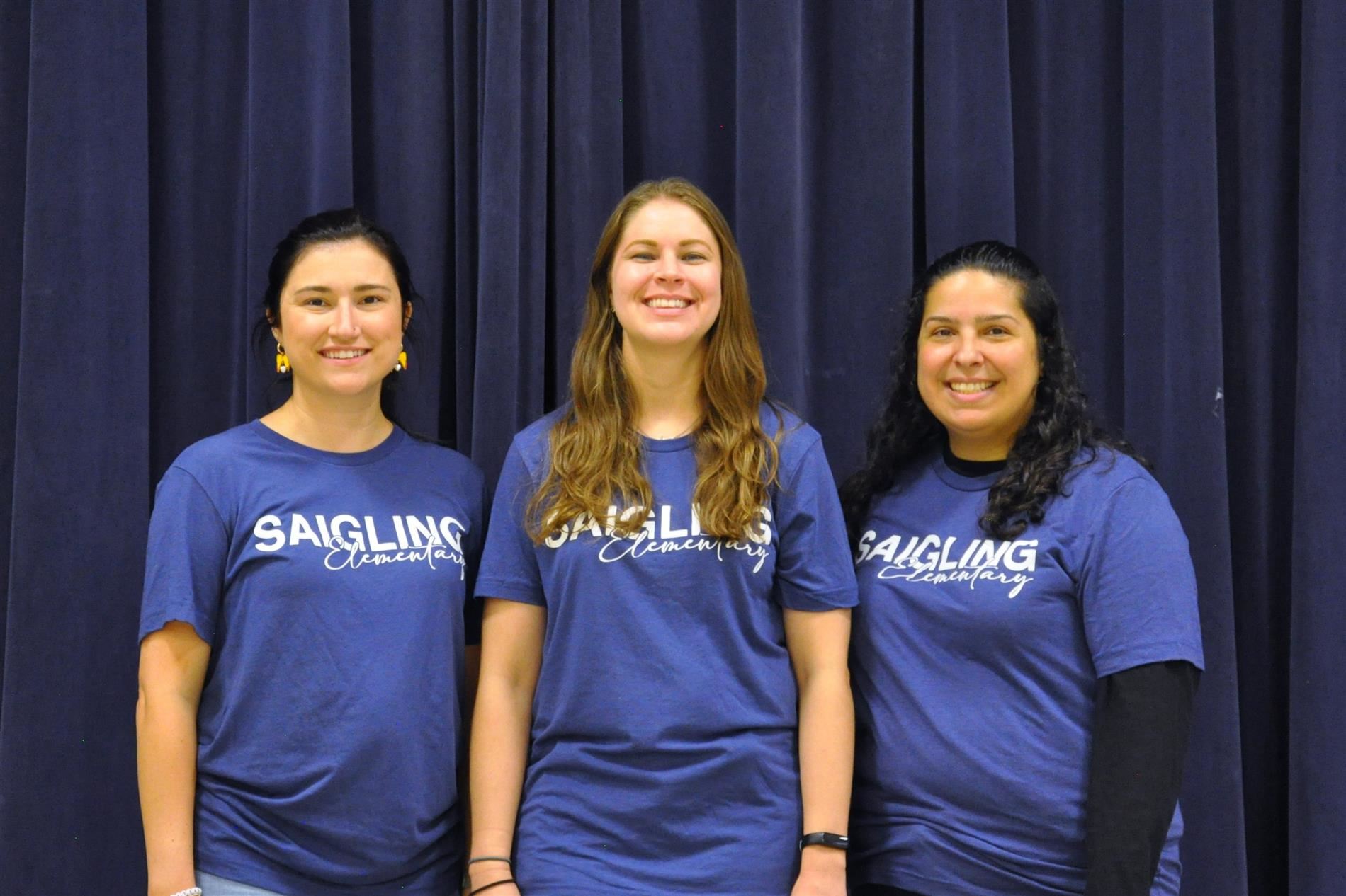 A picture of Ms. Attaway, Ms. Groen, and Ms. Snyder standing next to each other smiling.